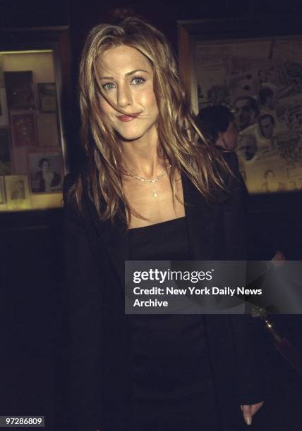 Jennifer Aniston attending movie premiere of "Meet Joe Black" at the Ziegfeld Theater.