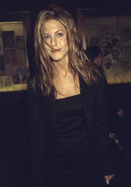 Jennifer Aniston attending movie premiere of "Meet Joe Black" at the Ziegfeld Theater.