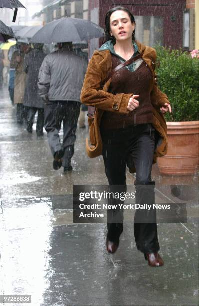 Jennifer Connelly runs in an artificial rainstorm at Fifth Ave. And E. 20th St. During filming of the new psychological thriller "Dark Water."