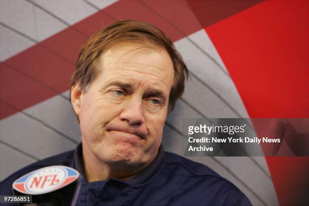 New England Patriots' head coach Bill Belichick is at the microphone during Media Day at the University of Phoenix Stadium, leading up to Sunday's...