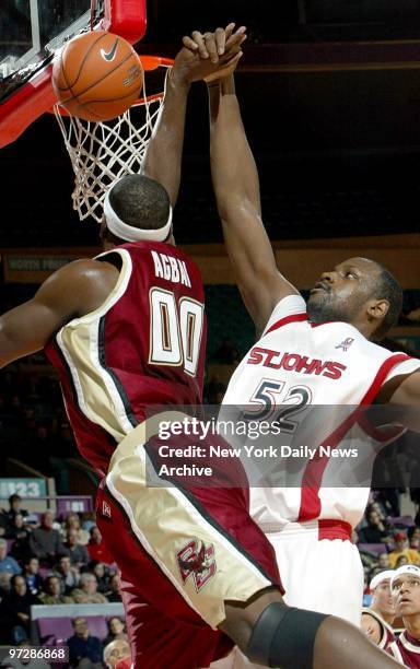 St. John's center Curtis Johnson blocks a shot by Uka Agbai as St. John's loses 89-61 to Boston College at Madison Square Garden. The Red Storm was...