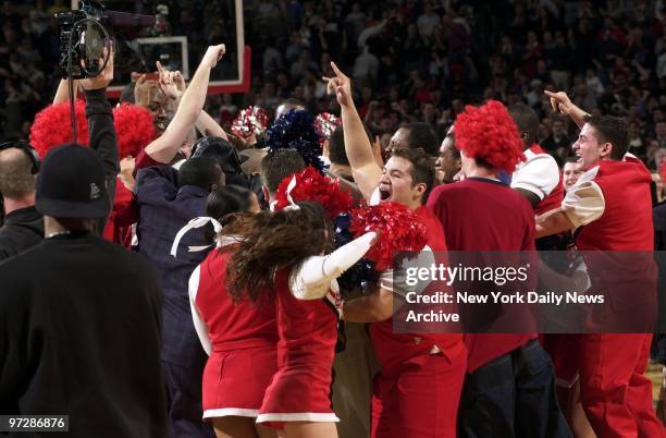 St. John's' cheerleaders and fans celebrate the Red Storm's 72-71 victory over the Duke Blue Devils at Madison Square Garden.