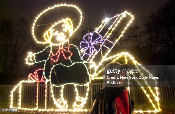 Jaymar Banaag of the Bronx enjoys the spectacle at the Bronx Zoo's annual "Holiday Lights" celebration.