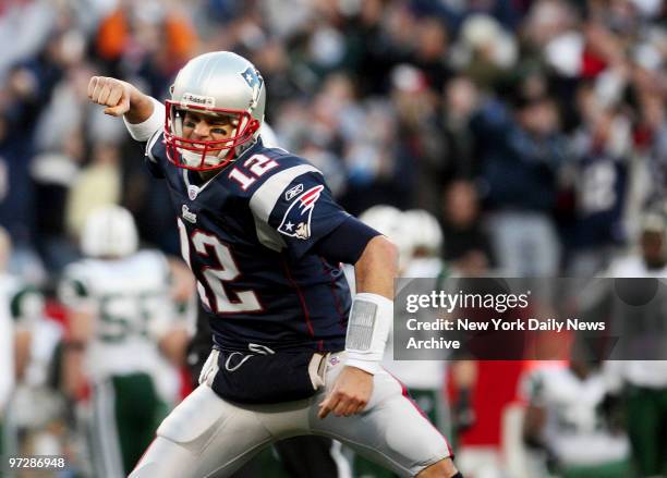 New England Patriots' quarterback Tom Brady celebrates after throwing a touchdown pass in the fourth quarter of the AFC wild-card game against the...