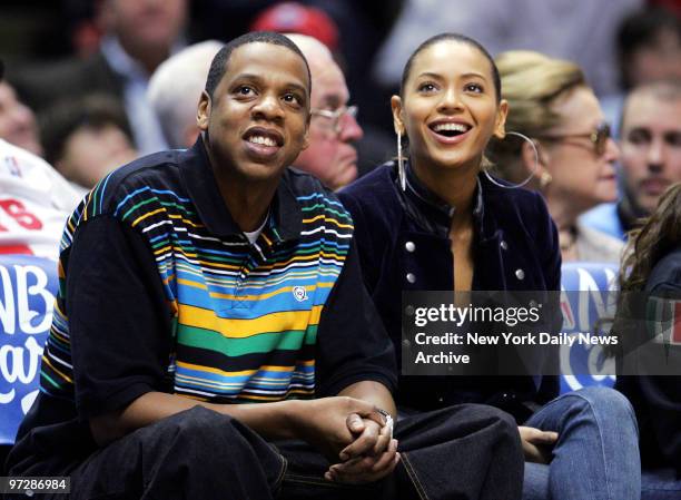 Jay-Z and Beyonce Knowles watch the first half of a New Jersey Nets game against the Dallas Mavericks at Continental Airlines Arena. The Nets went on...