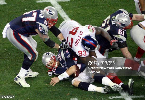 New England Patriots' quarterback Tom Brady is sacked by the New York Giants in the second quarter of Super Bowl XLII at the University of Phoenix...