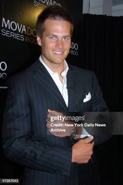 New England Patriots' quarterback Tom Brady shows off his Movado Sports Watch as he launches the Movado Series 800 Sport Watch Collection at their...