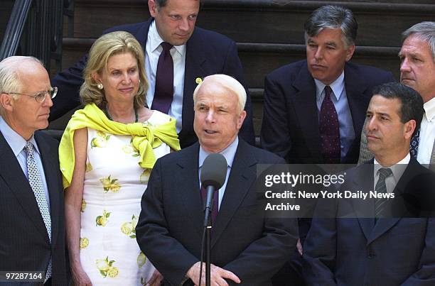 Sen. John McCain is joined by a bipartisan group as he speaks of his efforts to enact campaign finance reform outside Theodore Roosevelt's birthplace...