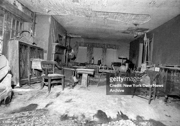 Main room of Edith Bouvier Beale at West End Road in East Hampton, L.I. Is filled with dusty furniture and much of ceiling plaster has fallen.