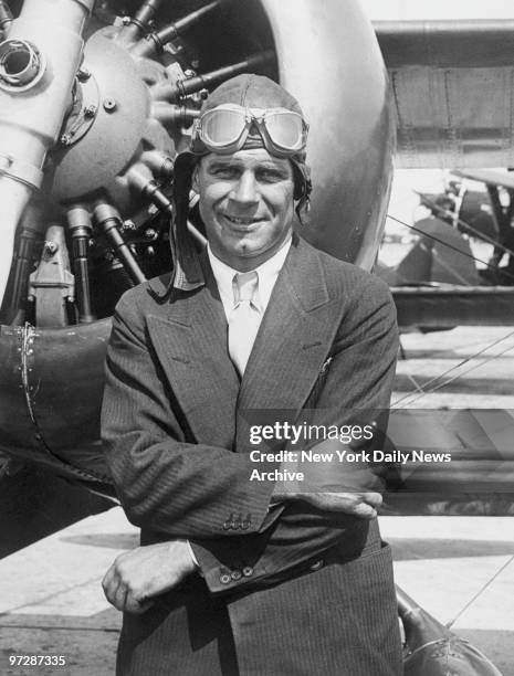 Major James H. Doolittle of the United States Army stands in front of his plane. In 1922, he made the first coast-to-coast flight in twenty-four...