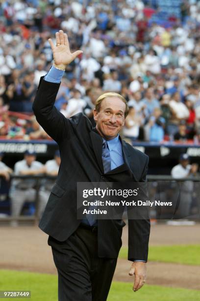 Former New York Mets' catcher Gary Carter - a recent Hall of Fame inductee - acknowledges the cheers of the crowd on Gary Carter Night at Shea...