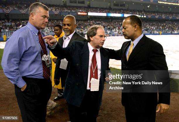 New York Yankees COO Lonn Trost makes choice to have tarp removed before it was put back on for the 2nd time when Game 2 of the American League...