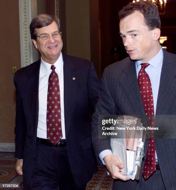 Majority Leader Trent Lott walks to the floor of the Senate for vote on the nuclear test ban treaty with assistant secretary to the majority Dave...
