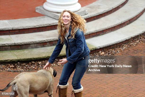 Jean Strahan, former wife of New York Giants' defensive end Michael Strahan, plays with her dog outside her Montclair, N.J., mansion, after reaping a...