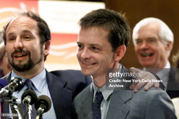 Sen. Paul Wellstone puts arm around actor Michael J. Fox during news conference with members of Congress on Capitol Hill. Fox is trying to obtain...