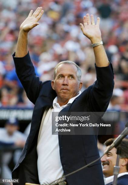 Former New York Mets' manager Davey Johnson, a veteran of the 1986 World Series winners, acknowledges the cheers of the crowd at Shea Stadium. He was...