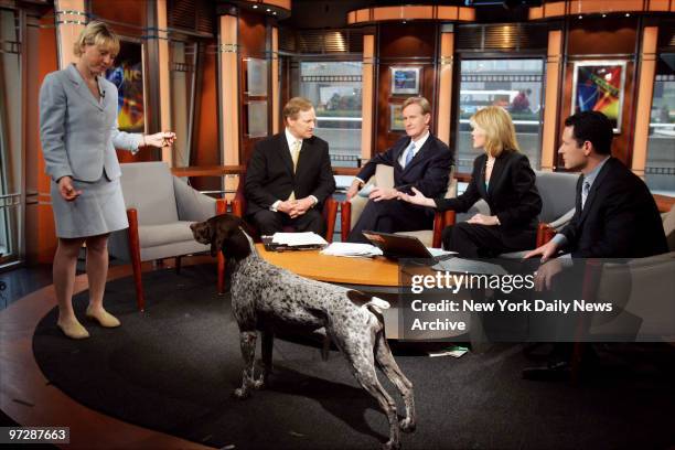 Carlee, a German shorthaired pointer, and her handler, Michelle Ostermiller, demonstrate the pose that won her the title of Best in Show at the...