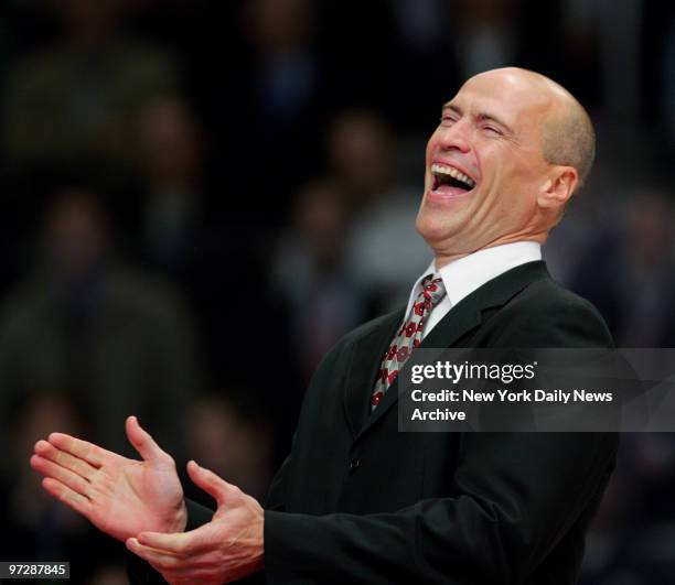 Former New York Rangers' captain Mark Messier laughs at a joke during an hour-long, pre-game ceremony to retire his No. 11 and raise it to the...