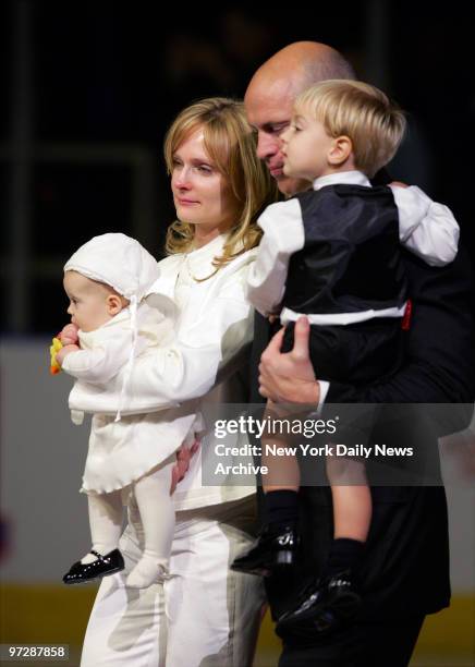 Former New York Rangers' captain Mark Messier stands with fianc?e Kim Clark, their baby daughter, Jacqueline Jean, and their son, Douglas Paul,...