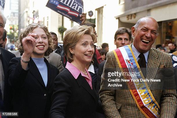 Senate hopeful Hillary Rodham Clinton is flanked by her daughter, Chelsea, and Grand Marshal Oscar de la Renta as they walk up Fifth Ave. In the 35th...