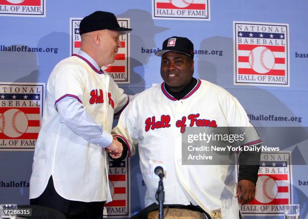 Cal Ripken Jr. And Tony Gwynn, wearing their Hall of Fame jerseys, shake hands during a news conference at the Waldorf-Astoria hotel announcing their...