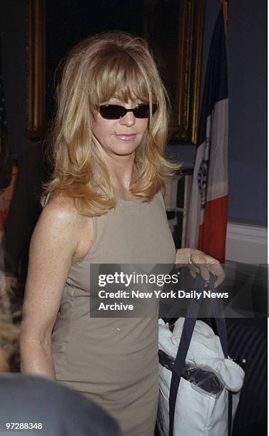 Goldie Hawn leaves the Blue Room at City Hall after ceremony proclaiming Out-of-Towners Day in the city. Hawn is starring in a movie called "The...
