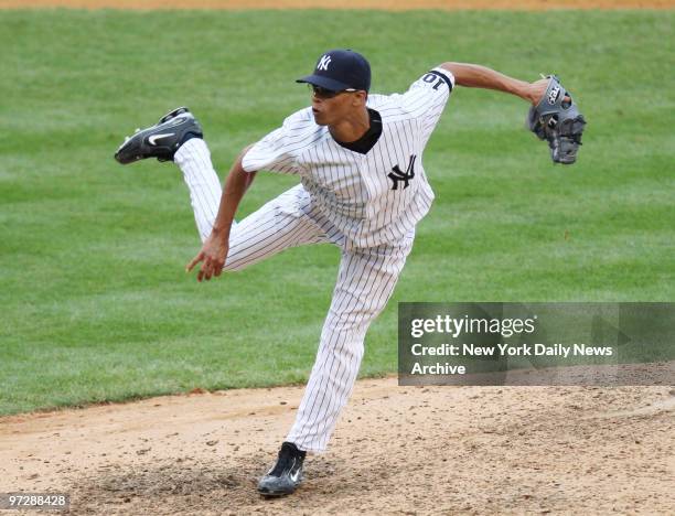 New York Yankees' reliever Edwar Ramirez delivers home in the eighth inning of a game against the Detroit Tigers at Yankee Stadium. Ramirez struck...