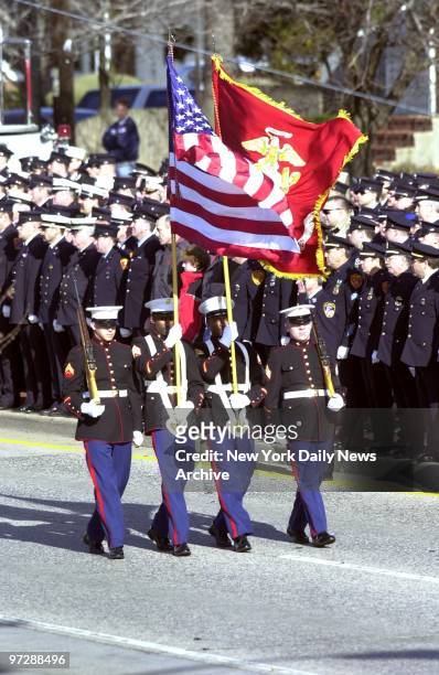 Marine Corps color guard passes by firefighters during memorial service for Deputy Chief Raymond Downey at Sts. Cyril and Methodius Church in Deer...