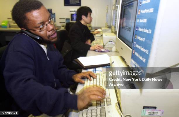 Former New York Times reporter Jayson Blair, whose fraudulent reporting kicked off a journalistic storm, checks his E-mail while speaking on the...