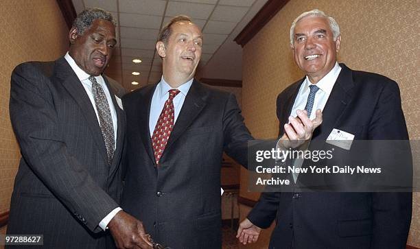 Senator Bill Bradley , at his fundraiser at the Sheraton Hotel in Manhattan, talks to old Knicks teammates Willis Reed and Dave DeBusschere.