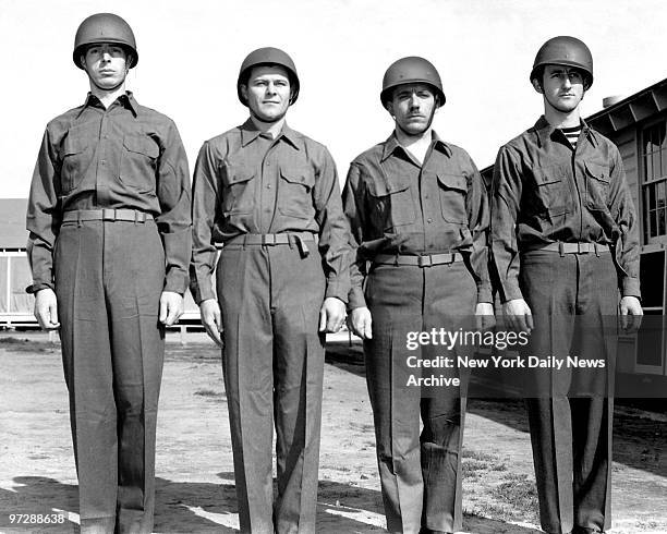 Former New York Yankee centerfielder Joe DiMaggio, joins his fellow recruits in a bigger yank outfit as he starts his first day of drill after...