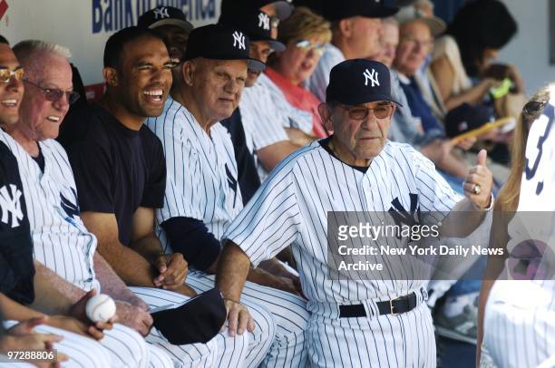 Former New York Yankees' catcher and Hall of Famer Yogi Berra joins other former Yanks and closer Mariano Rivera in the dugout during 58th annual...