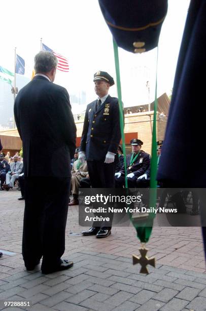 Capt. Kenneth Girven stands ready to receive the Combat Cross, the second highest departmental award for valor, during the NYPD Medal Day ceremony at...