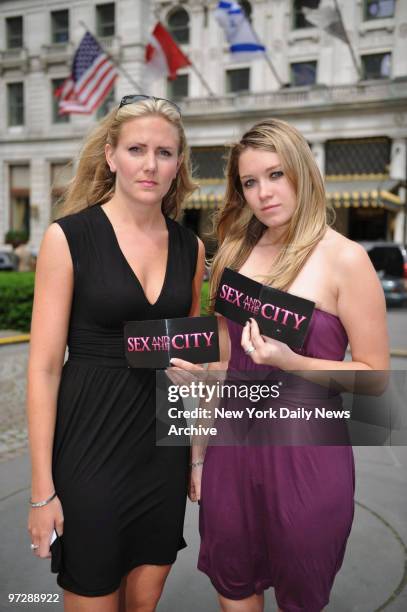 Jen Ferguson and Devon Cross both of Victoria, British Columbia, pose in front of The Plaza Hotel in Manhattan with their worthless Sex and The City...