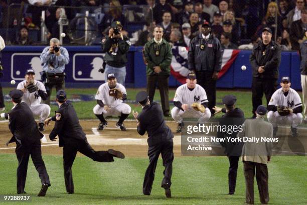 Members of the Police and Fire Departments throw out the first pitches at a pregame ceremony in Yankee Stadium honoring the victims of the Sept. 11...