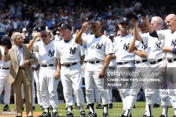 Former New York Yankees' legends Phil Rizzuto, Yogi Berra, Whitey Ford, Reggie Jackson, Don Mattingly and other Yankee greats tip their caps to the...