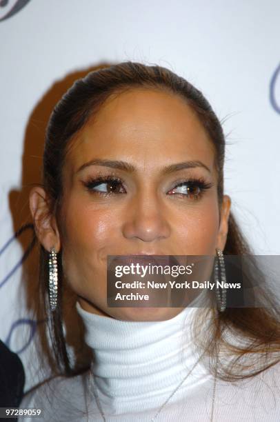 Jennifer Lopez poses for photographs backstage at a showing of her fall 2005 collection in the Tent at Bryant Park during Fashion Week.