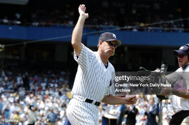 Former New York Yankees' pitcher Rich Gossage waves to the crowd during 58th annual Old-Timers' Day ceremonies at Yankee Stadium. The Yanks later...
