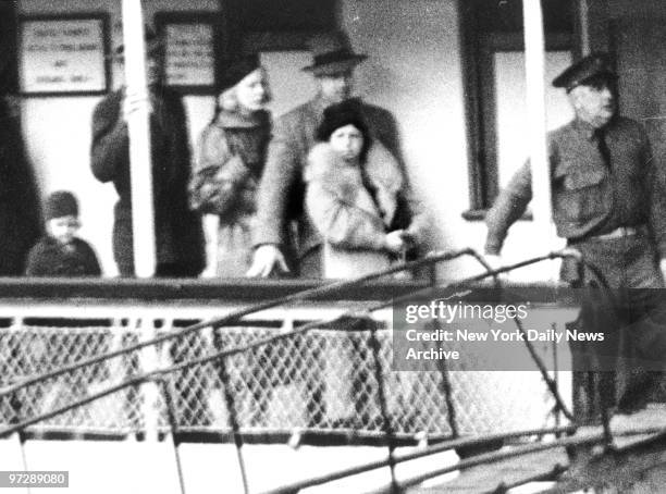 Mamie Capone, wife of Al Capone going to visit her husband who is serving a sentence on Alcatraz Island for income Tax evasion.