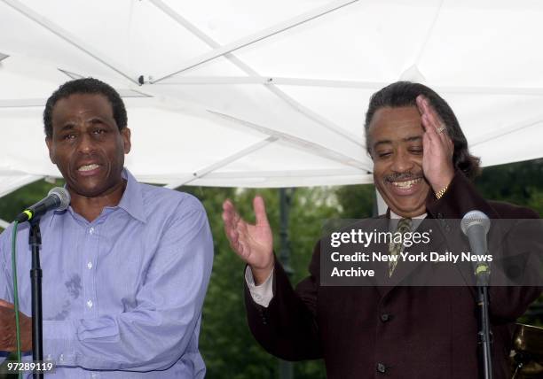 The Rev. Al Sharpton expresses his approval of remarks by state Controller Carl McCall at a W. 135th St. Fair marking the close of Harlem Week.