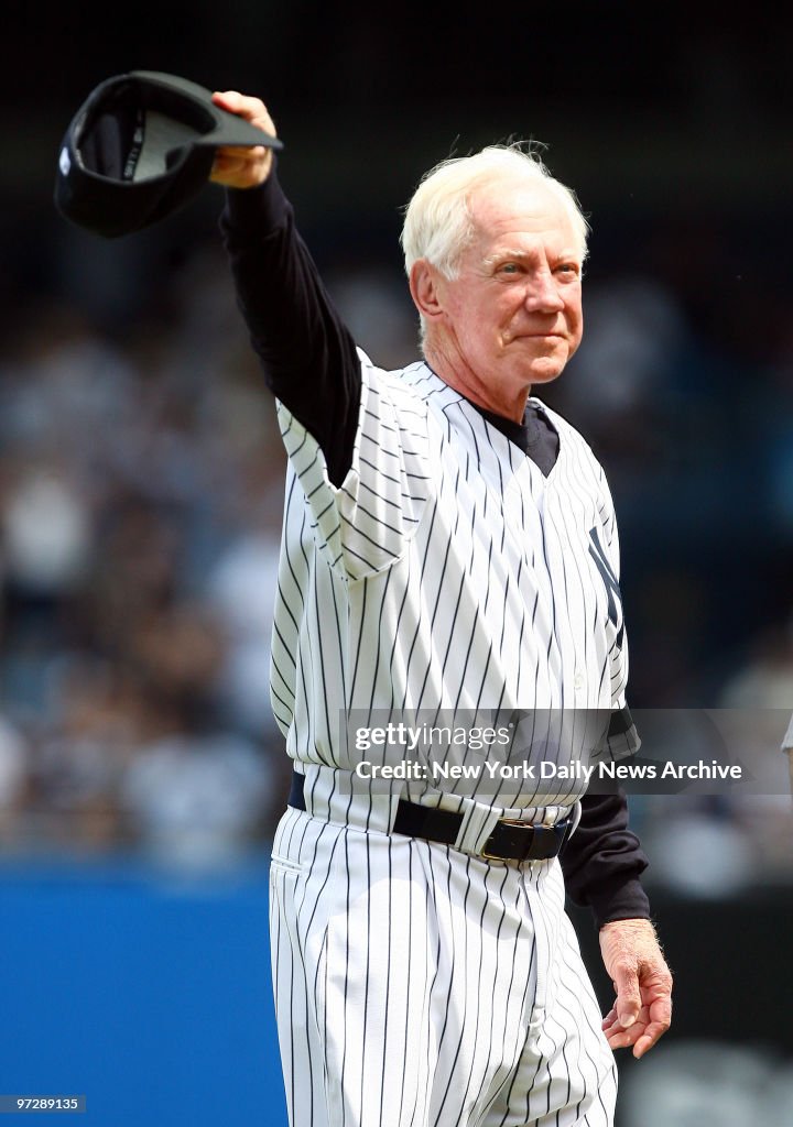 Former New York Yankees' pitcher Whitey Ford tips his hat to