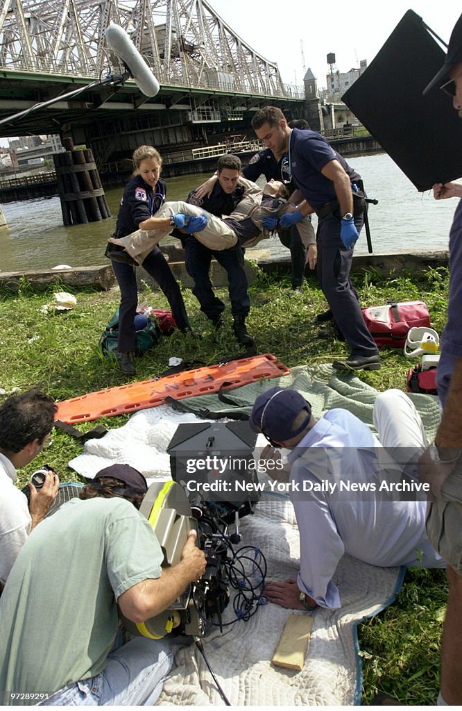 Camera records the action as "victim" is carried from the wa