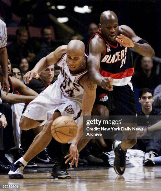 New Jersey Nets' Richard Jefferson and Portland Trail Blazers' Ruben Patterson chase a loose ball during action at Continental Airlines Arena. The...