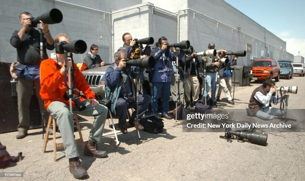 Cameras are set up as media covers the funeral of Rachel Sco