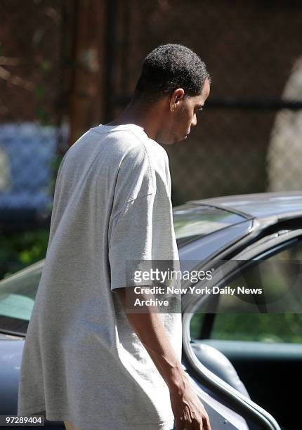 Man identified as Greg, the boyfriend of Nicole Sutton, leaves the Wyckoff Gardens housing project in Brooklyn, where Sutton was caught in crossfire...