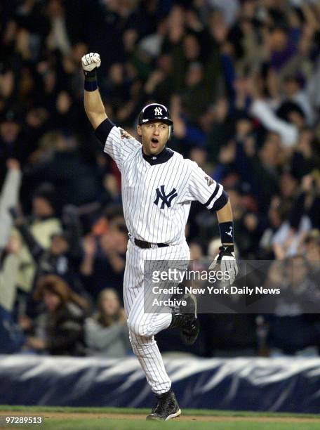 New York Yankees' Derek Jeter celebrates after hitting game winning homerun in 10th inning against Arizona Diamondbacks in 2001 World Series.