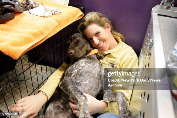 Jennifer Broome of Canterbury, Conn., relaxes with Elsie, a German shorthaired pointer, backstage during the 132nd annual Westminster Kennel Club dog...