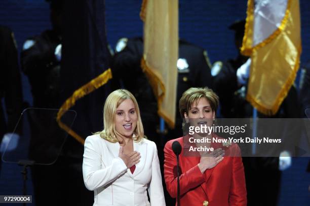 Former Olympic gymnasts Kerri Strug and Mary Lou Retton lead the delegates in the Pledge of Allegiance on the final day of the Republican National...