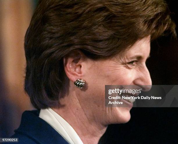 New Jersey Gov. Christie Whitman smiles at a news conference in Trenton.