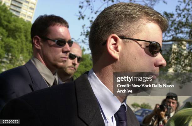 Former Police Officers Thomas Wiese and Thomas Bruder enter Brooklyn Federal Court for a hearing on jailed former Police Officer Charles Schwarz'...